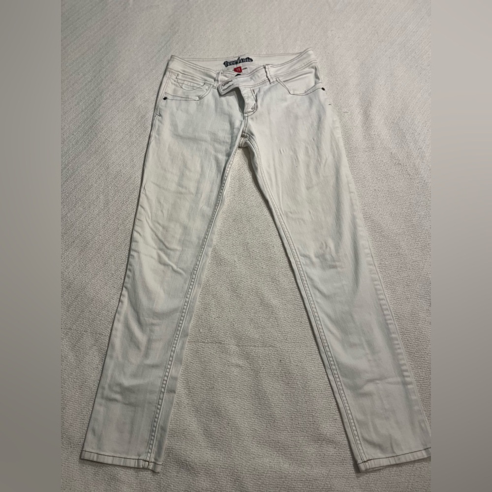 White jeans great stretch. I am a size 6-8 these are 11 teen cool tan stitching